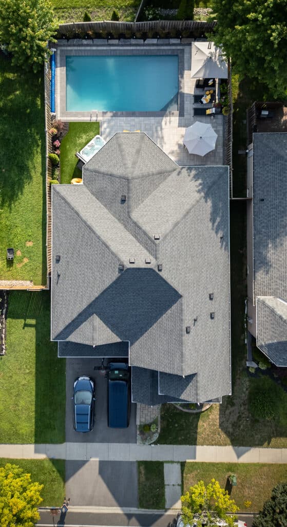 An overhead shot of a home, prominently displaying OGS's landscape work in the backyard.