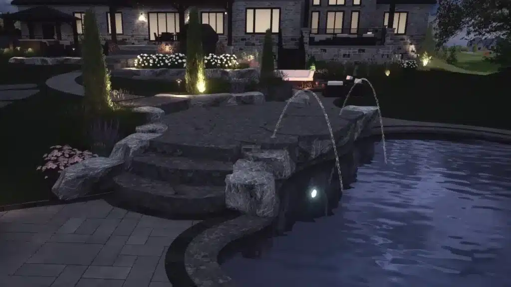 A beautiful back yard landscape light up in a nighttime setting with a small water pool, steps and two water fountains. Designed by OGS Landscapes.